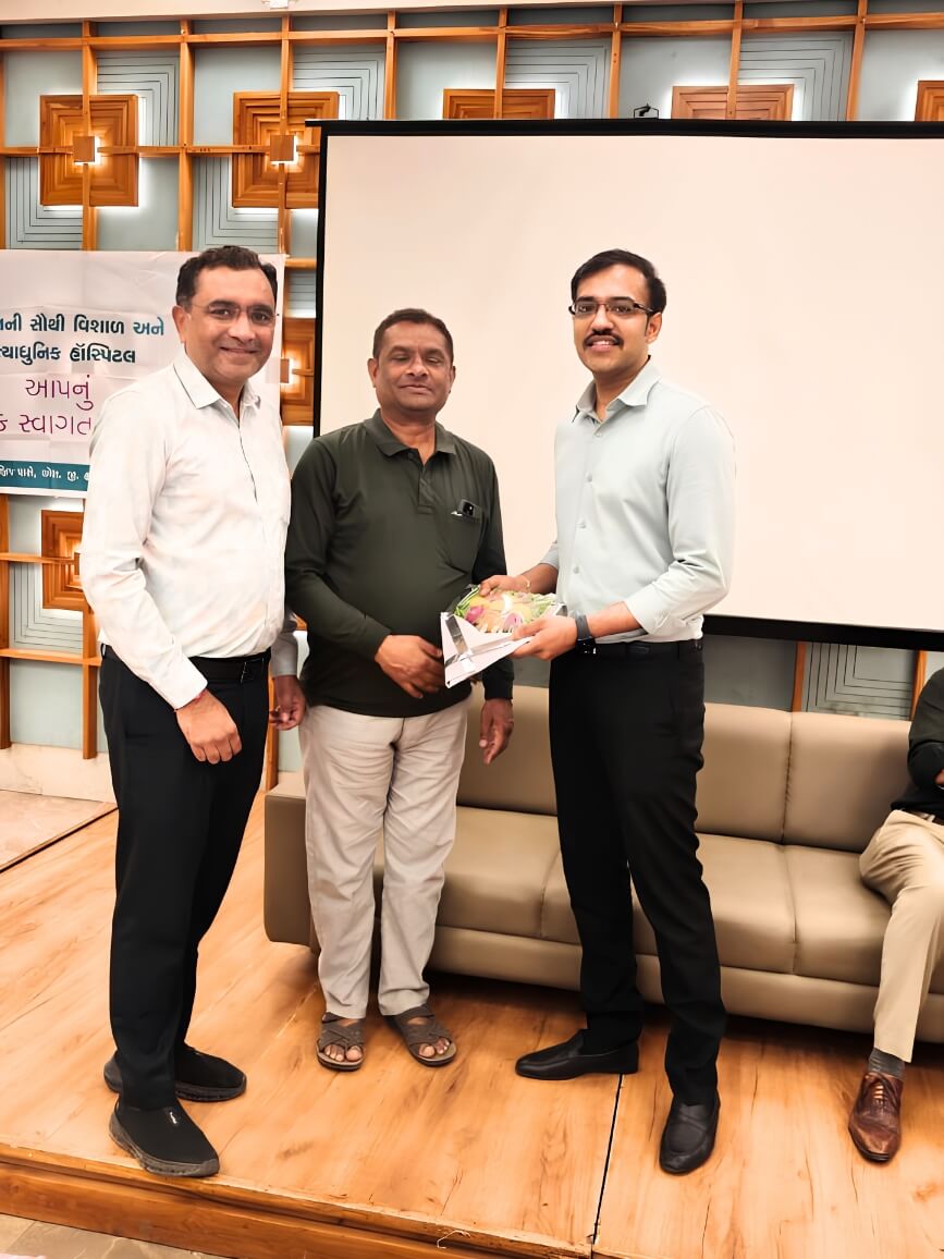 Dr. Bhatt at a community health fair – Awareness & Outreach
